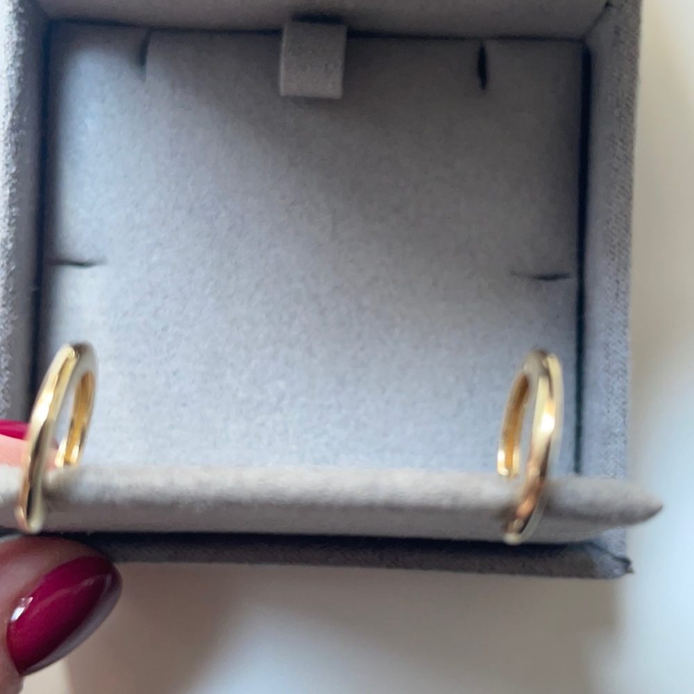 Ferko’s baby gold hoops.